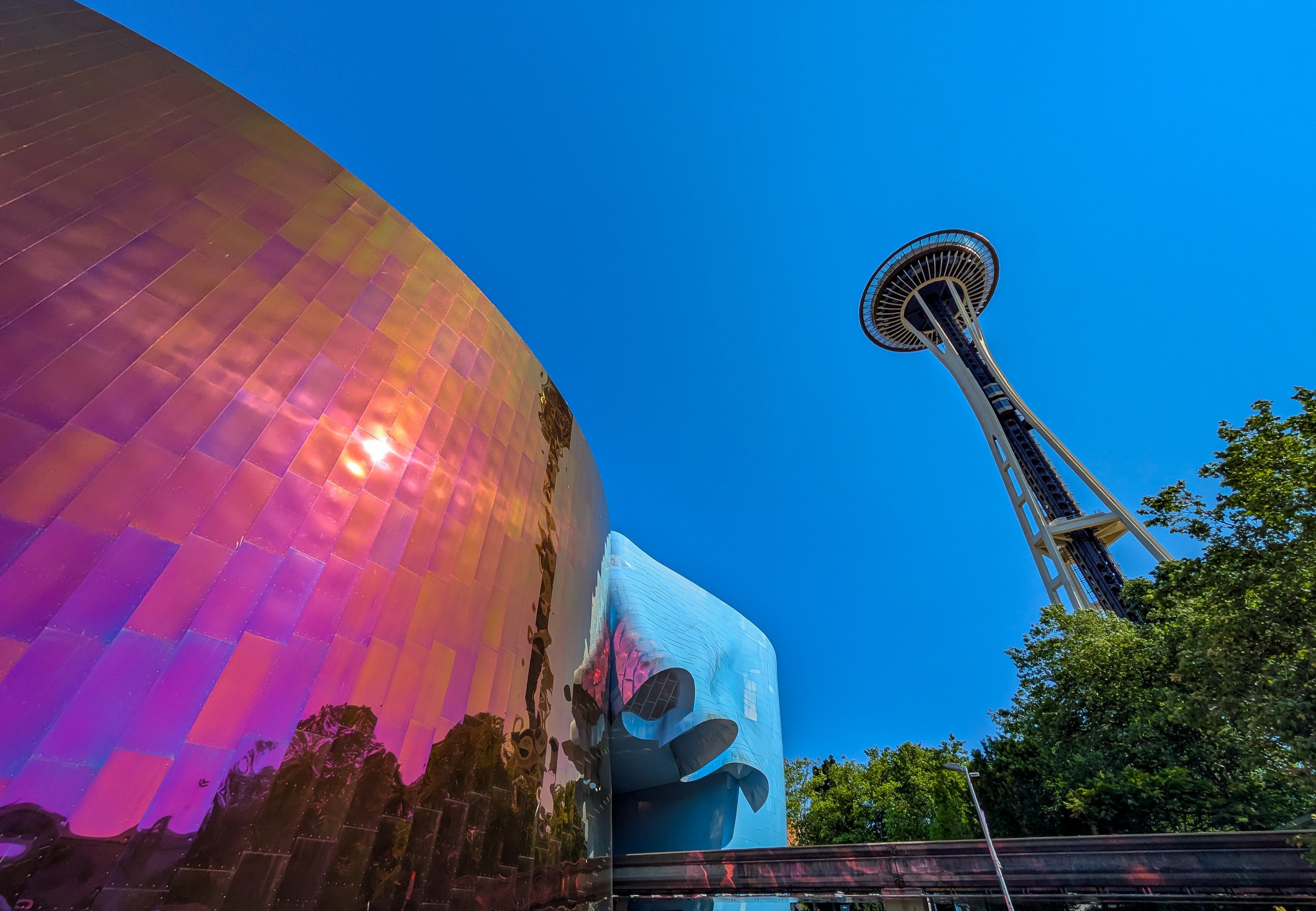 The Museum of Pop Culture and Space Needle rise against a clear blue sky.