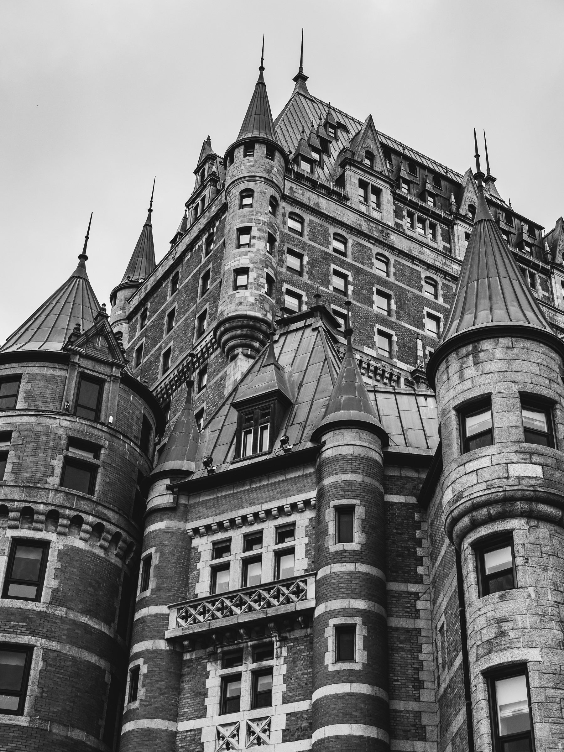 Château Frontenac, a historic stone hotel with turrets and spires dominates the Quebec City skyline.